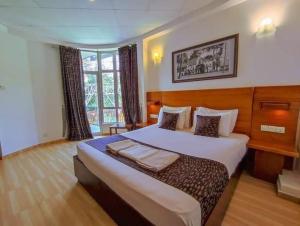 Postel nebo postele na pokoji v ubytování Kandyan View Holiday Bungalow'' FREE PICKUP FROM KANDY CITY'' + 21 fotografií