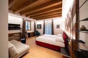 Postel nebo postele na pokoji v ubytování Wine Hotel Ristorante San Carlo - Boutique Hotel & SPA