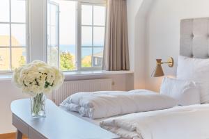 Postel nebo postele na pokoji v ubytování Hôtel de Ville