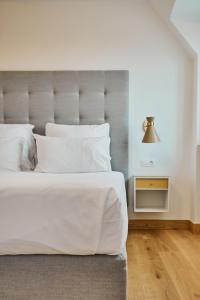 Postel nebo postele na pokoji v ubytování Hôtel de Ville