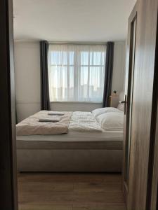 Postel nebo postele na pokoji v ubytování Smarty Choice Flat with Deluxe Kitchen