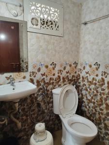 Koupelna v ubytování Janatha Homestay + 37 fotografií
