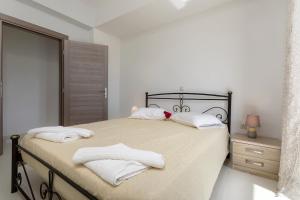 Voodi või voodid majutusasutuse One and only Villa at NAvagio Zakynthos toas