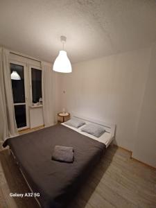 Łóżko lub łóżka w pokoju w obiekcie Hel na wakacje