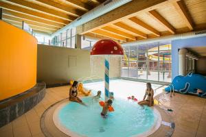 a group of children playing in a swimming pool at Via Cancano Valdidentro-Bormio in Valdidentro