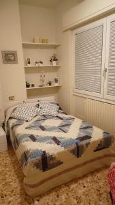 Postel nebo postele na pokoji v ubytování Casa Vacanze da Emanuela + 37 fotografií