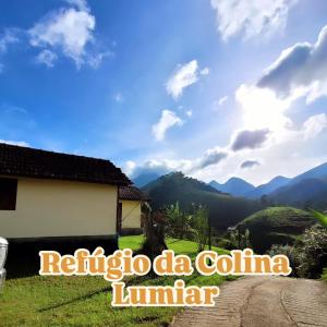 a view of the mountains from a house at Refúgio da Colina Lumiar 3quartos 2banheiros 10pessoas in Nova Friburgo