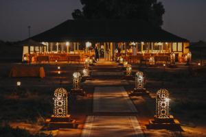 a wedding venue with lights at night at Paradise Luxury Camp in Merzouga