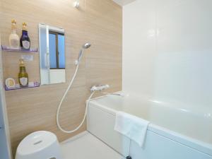 Koupelna v ubytování USJまで電車で5分 Meeno Home西九条美の宿親子向け民泊 マリオパワーアップバンド ReFa美顔シャワー付き 広々空間 好アクセス