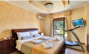 Postel nebo postele na pokoji v ubytování Cretan Sunny Villa + 37 fotografií