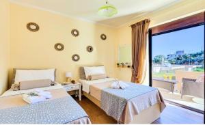 Postel nebo postele na pokoji v ubytování Cretan Sunny Villa