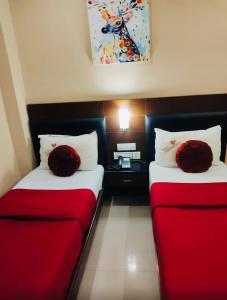 Rúm í herbergi á Hotel Nakshatra Inn VL Tuticorin