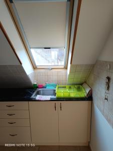 Kuchyňa alebo kuchynka v ubytovaní Zita Apartman