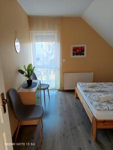 Posteľ alebo postele v izbe v ubytovaní Zita Apartman