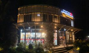 a building with a store front at night at ZenSuites Hotel Tacloban in Tacloban