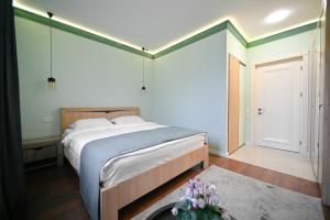 Postel nebo postele na pokoji v ubytování Mon Invite Hotel