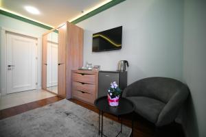 TV a/nebo společenská místnost v ubytování Mon Invite Hotel