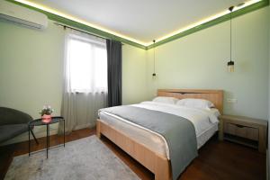 Postel nebo postele na pokoji v ubytování Mon Invite Hotel