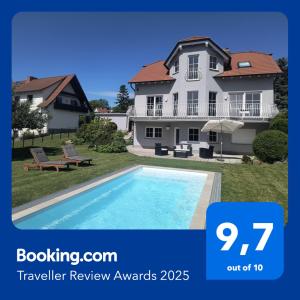 a picture of a house and a swimming pool at Idyllische Lage im Süden Erfurts in Erfurt
