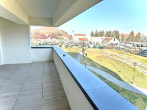 a balcony with a view of a city at 4FriendsBrasov K34 in Braşov
