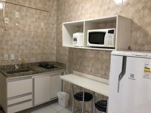 Η κουζίνα ή μικρή κουζίνα στο Lagoa quente service Flat