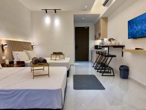 Μια τηλεόραση ή/και κέντρο ψυχαγωγίας στο Hush Inn at Sutera Bay Kota Kinabalu +6 φωτογραφίες