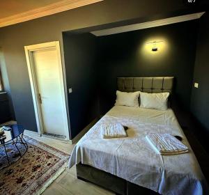 Postel nebo postele na pokoji v ubytování Arena Resort Otel Kagıthane