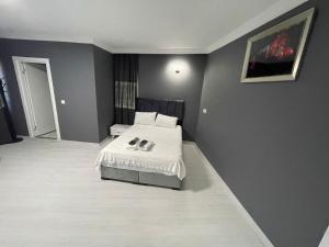 Postel nebo postele na pokoji v ubytování Arena Resort Otel Kagıthane