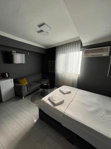 Postel nebo postele na pokoji v ubytování Arena Resort Otel Kagıthane