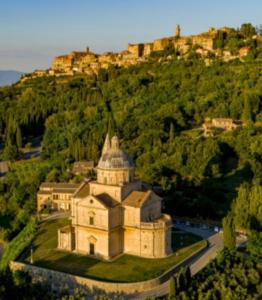 a large building on top of a hill at Appartamento Panoramico in Montepulciano