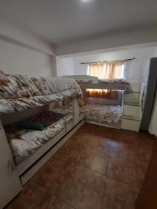 a bedroom with two bunk beds in a room at Morada del sur in Ushuaia