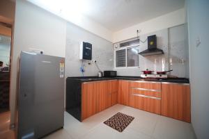 Η κουζίνα ή μικρή κουζίνα στο 2BHK Fully Furnished Apartment by The Signature Stays