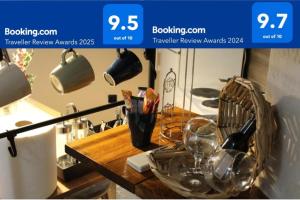 a kitchen counter with a table with glasses on it at Apartman AS in Belgrade