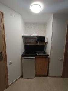Kuchyň nebo kuchyňský kout v ubytování Hotel Le Beauregard