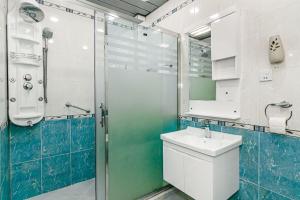 a bathroom with a shower and a toilet and a sink at Apartment Azercell in The Fountain in Baku +22 photos