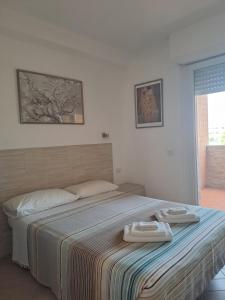 Posteľ alebo postele v izbe v ubytovaní "VACANZA A CASA" - Gallicano & Gallicano2