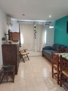 a living room with a couch and a table at MALLORCA Aparts in Colón