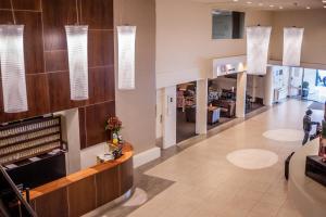 a lobby of a hospital with pendant lights at West Plaza Hotel in Wellington