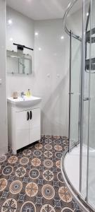 a bathroom with a shower and a sink and a toilet at CHARMING VICTORIAN APARTMENT, close to centre in Inverness