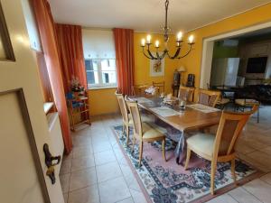 a dining room with a table and chairs at House MayFa in Riedseltz