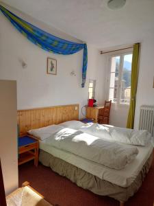 Postel nebo postele na pokoji v ubytování La Fontaine - Chambres d'Hôtes