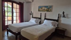 Postel nebo postele na pokoji v ubytování Villa Colina Ibiza