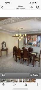 a living room with a dining room table and chairs at The Garcias Village C with Jacuzzi ACNetflix in La Alianza