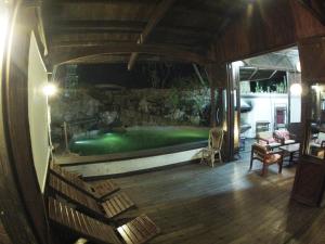 a room with a pool in the middle of a house at Bukit Raya Guesthouse in Palangkaraya