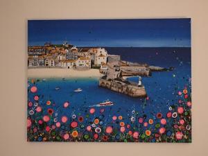 a painting of a beach with umbrellas in the water at Central located apartment with parking in Cheltenham