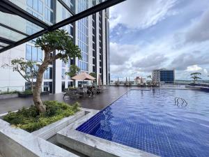 a swimming pool on the roof of a building at Panoramic Seaview Studio High-Floor and Free WiFi in Batam Center