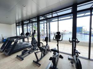 a gym with treadmills and ellipticals in a building at Panoramic Seaview Studio High-Floor and Free WiFi in Batam Center