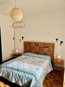 En eller flere senge i et værelse på Villa Donna Toni