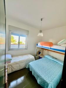 En eller flere senge i et værelse på Villa Donna Toni