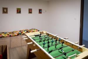 a billiard table with a in a room at Le Petit Fief in Couvin